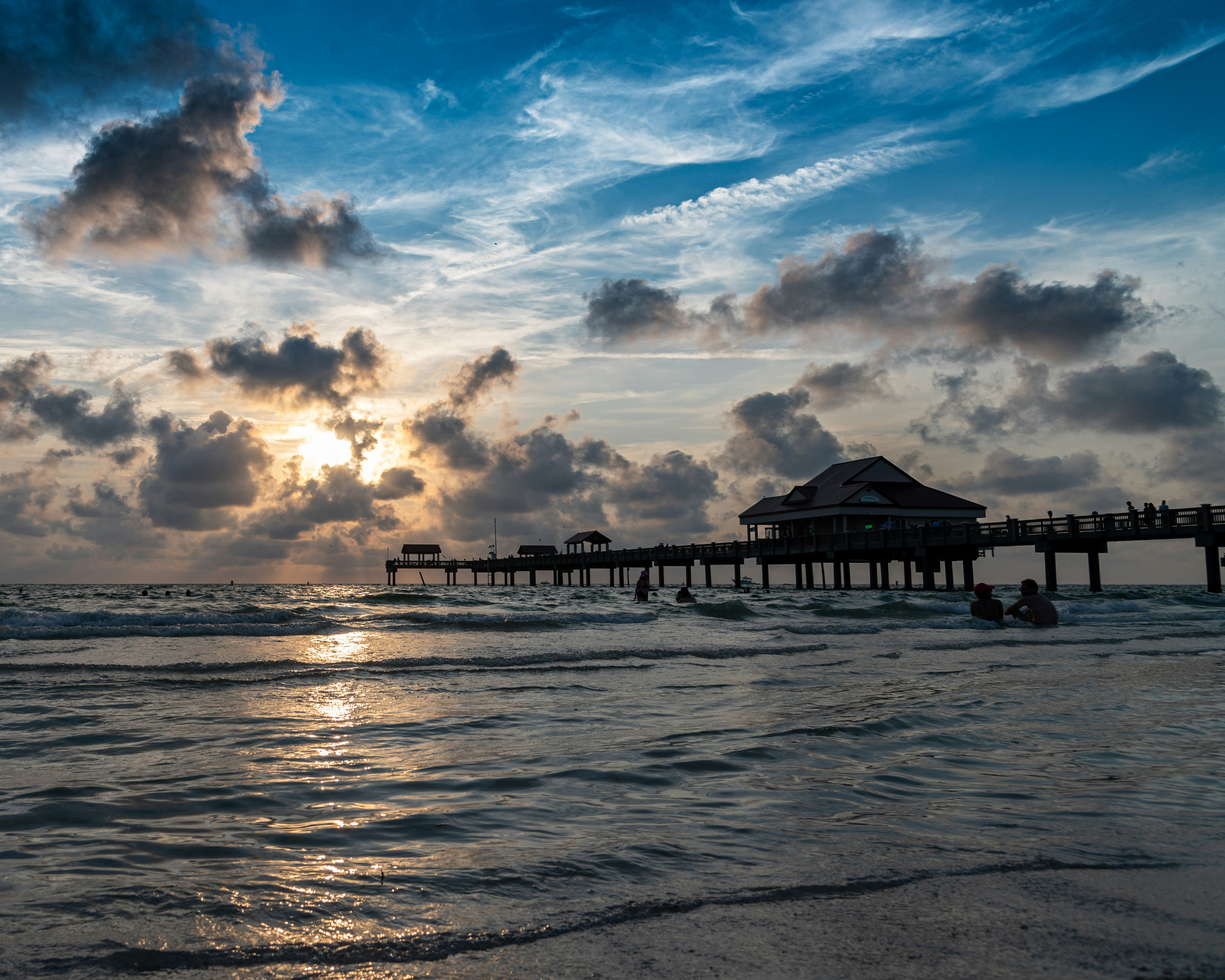 Clearwater Pier 60 at sunset with swimmers in the foreground